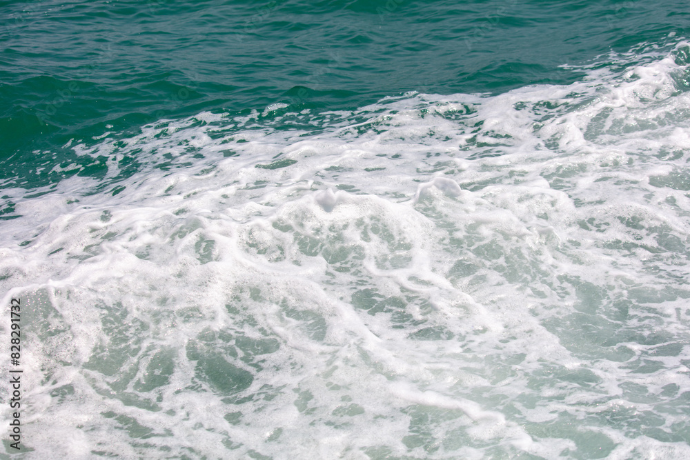 Fototapeta premium Waves in the sea abstract background. Texture