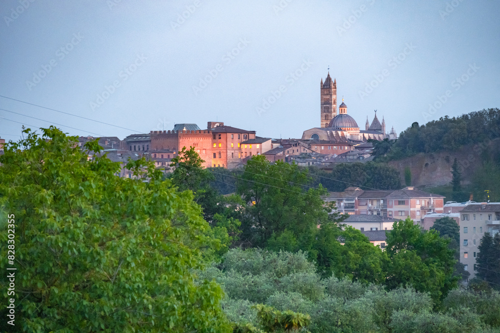 Obraz premium Siena, medieval town in Tuscany, with view of the Dome & Bell Tower of Siena Cathedral, Mangia Tower and Basilica of San Domenico, Italy