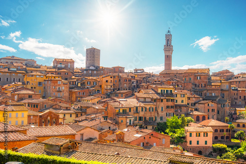 Siena, medieval town in Tuscany, with view of the Dome & Bell Tower of Siena Cathedral, Mangia Tower and Basilica of San Domenico, Italy