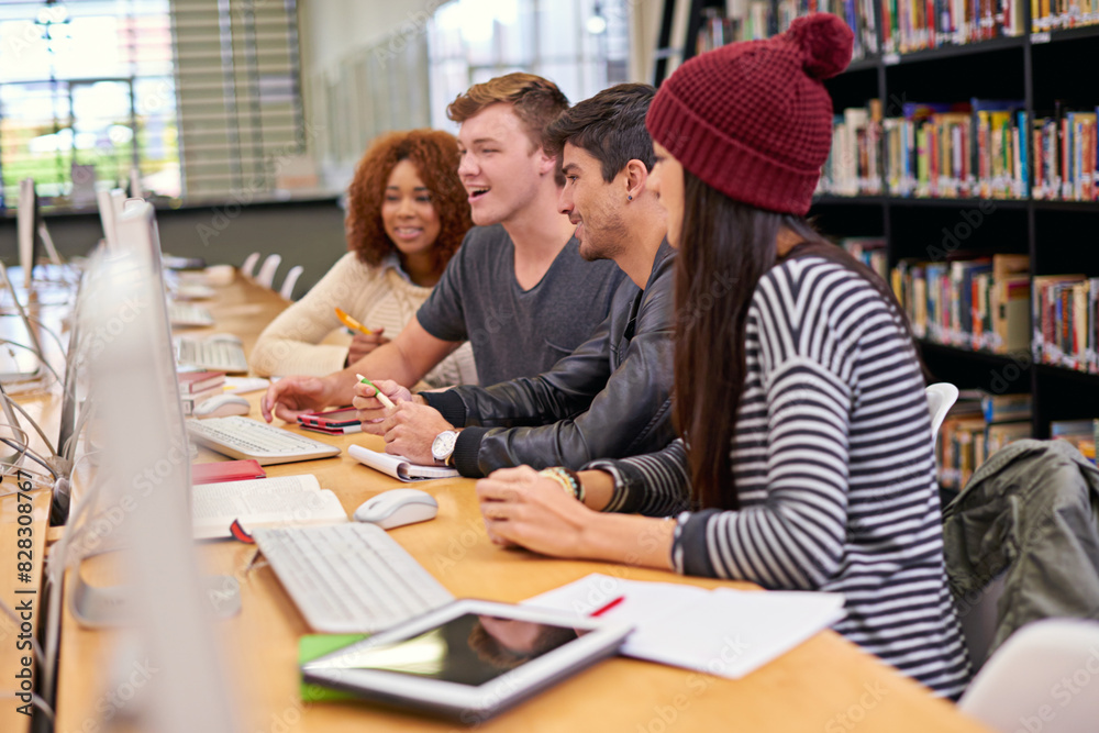 Students, friends and library with computer at university for education, learning or discussion on project. College, online and diverse learners for scholarship, knowledge or working on assignment Students, friends and library with computer at university for education, learning or discussion on project. College, online and diverse learners for scholarship, knowledge or working on assignment