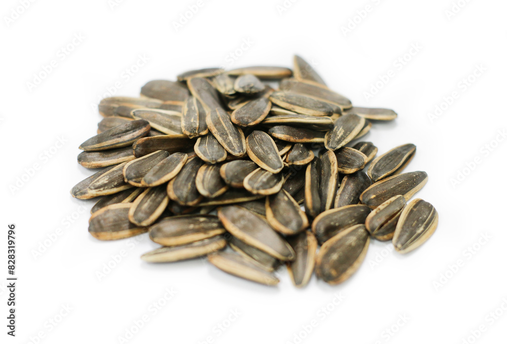 Closeup of sun flower seeds on a white background with clipping path Closeup of sun flower seeds on a white background with clipping path