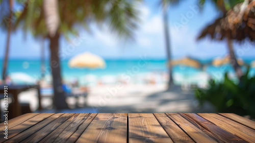 A wooden table with a view of the ocean and palm trees