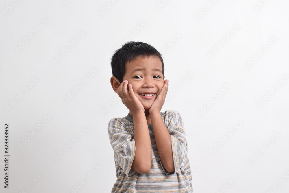 Image of Asian child posing on white background. portrait of an Asian boy in a cute pose Image of Asian child posing on white background. portrait of an Asian boy in a cute pose