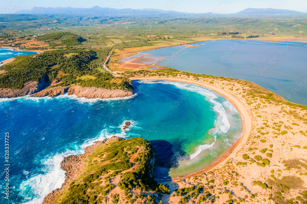 Fototapeta premium Aerial view of voidokilia beach, lagoon with beaches in mediterranean, Ionian Sea, Pylos town , Greece. Navarino Castle on hill.