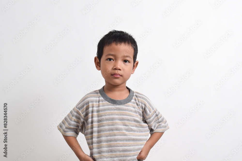 Image of Asian child posing angry face on white background. portrait of an Asian boy Image of Asian child posing angry face on white background. portrait of an Asian boy