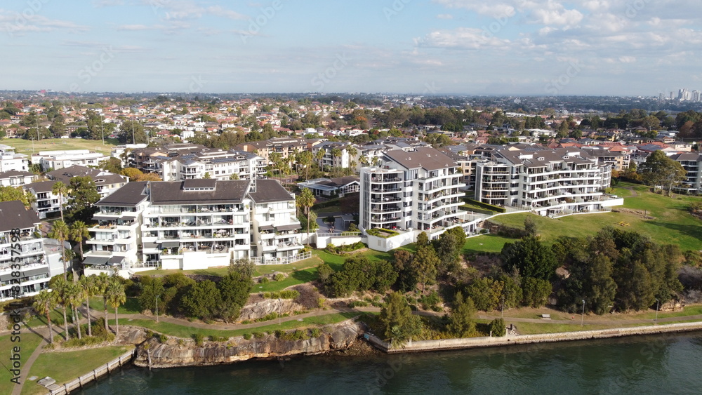 Fototapeta premium Aerial drone view of waterfront property and houses