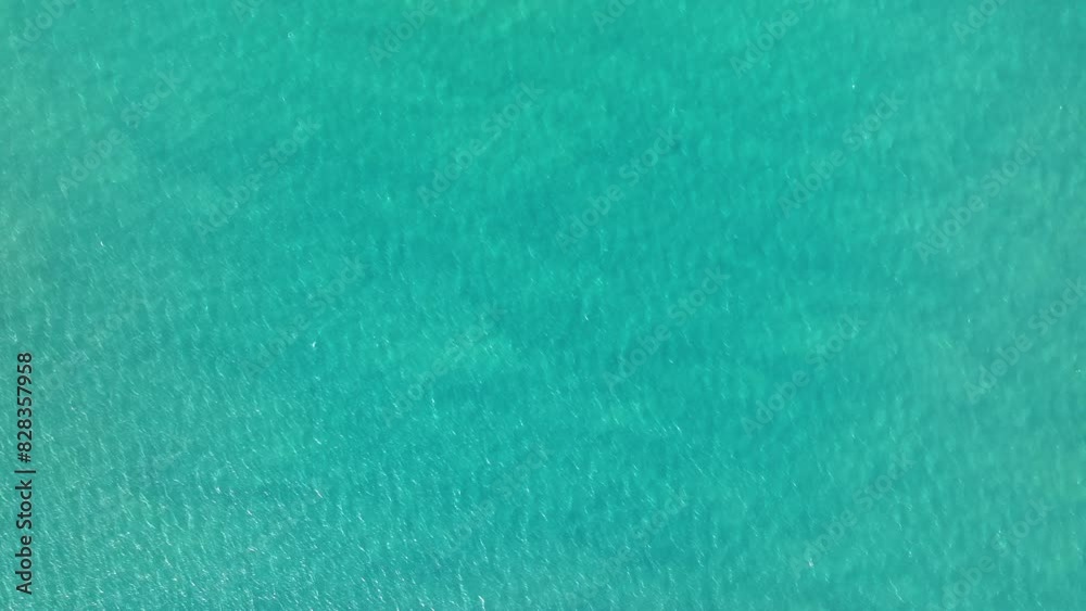 Ocean surface aerial view, sea water texture background by drone. Beautiful and fresh blue wavy water, calm and meditative nature concept. Ocean surface aerial view, sea water texture background by drone. Beautiful and fresh blue wavy water, calm and meditative nature concept.