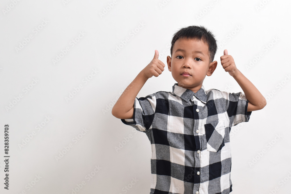 image of asian child posing on a white background. pose showing thumbs up image of asian child posing on a white background. pose showing thumbs up