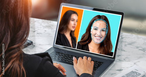 Quadro su tela Businesswoman using laptop with biometric scanning hologram, face swapping