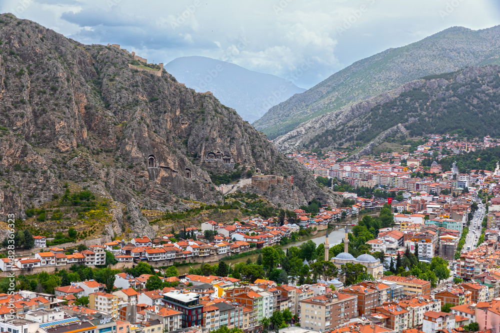 Fascinating view of the city of Amasya, also known as the city of princes. wonderful clouds coming out of the mountains. YESILIRMAK river. Fascinating view of the city of Amasya, also known as the city of princes. wonderful clouds coming out of the mountains. YESILIRMAK river.