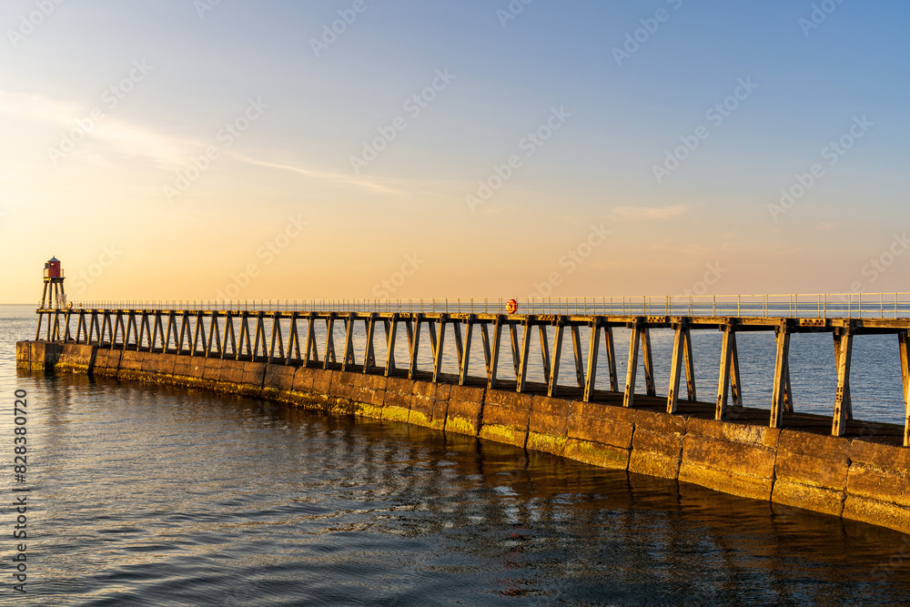 Fototapeta premium The East Pier in Whitby, England, UK