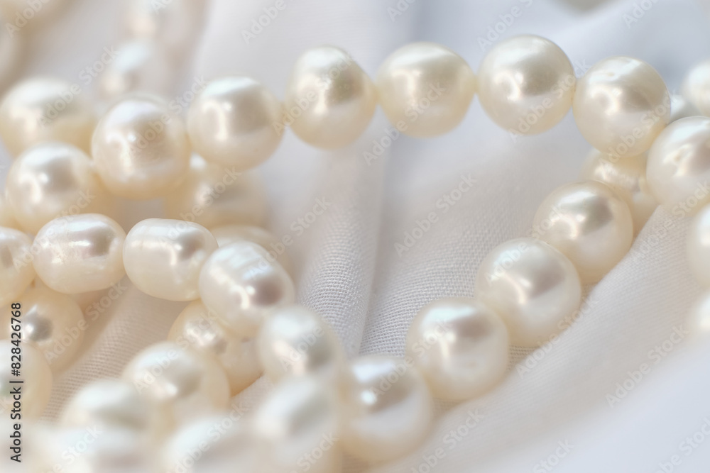 The whimsical placement of pearls on a white cloth depicts a serene, dreamy scenario. It's an invitation to pause and appreciate the natural amidst the rush for the new and artificial. The whimsical placement of pearls on a white cloth depicts a serene, dreamy scenario. It's an invitation to pause and appreciate the natural amidst the rush for the new and artificial.