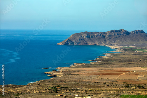 View from a viewpoint of the Puntas de Calnegre regional park in the Region of Murcia, Spain with its coves and arid landscape photo