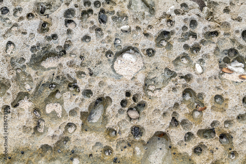 Beachrock is a friable to well-cemented sedimentary rock that consists of a variable mixture of gravel-, sand-, and silt-sized sediment. fragments of coral and shells . Geology of Oahu Hawaii. Tafoni  photo