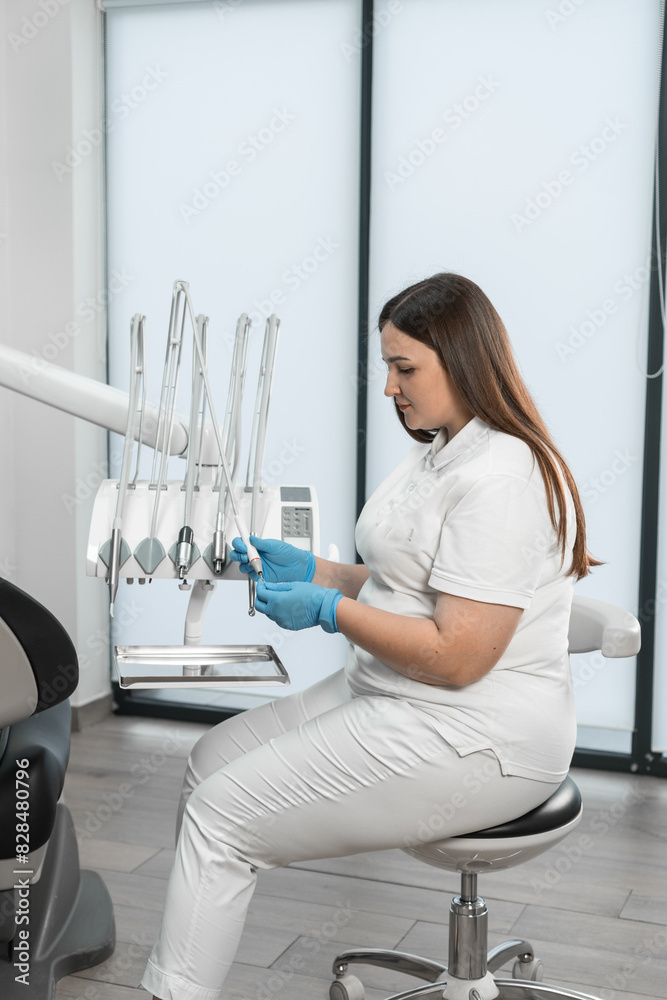 Modern equipment is visible in the background, which indicates the high professional level of the doctor and her willingness to provide the best dental care. With stylish design and expressions of Modern equipment is visible in the background, which indicates the high professional level of the doctor and her willingness to provide the best dental care. With stylish design and expressions of