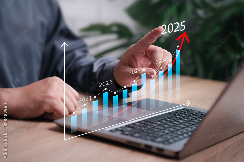 Business Goals Trends 2025 concept, Businessman use laptops for analytical business planning, Digital marketing and future possibilities, profit income, economy, stock market trends Business Goals Trends 2025 concept, Businessman use laptops for analytical business planning, Digital marketing and future possibilities, profit income, economy, stock market trends
