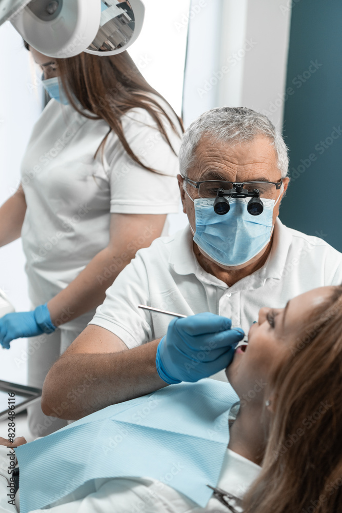 The dentist and his assistant perform effective teamwork during the treatment of the patient. Each of them fulfills its role, directing all efforts to improve the state of oral health. The dentist and his assistant perform effective teamwork during the treatment of the patient. Each of them fulfills its role, directing all efforts to improve the state of oral health.
