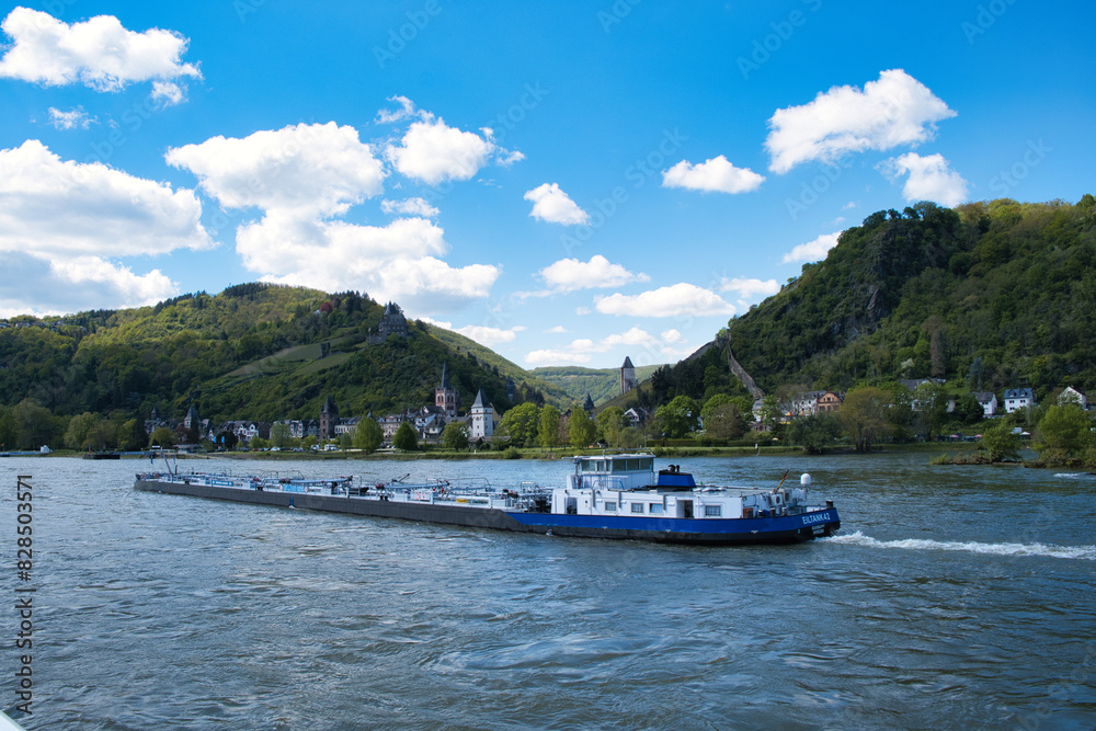 Obraz premium River boat sailing with hills in the backdrop, Rhine, Germany