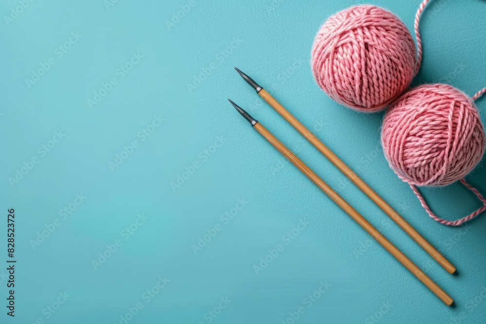 Balls of thread with needles is on blue background. Copy space for text Balls of thread with needles is on blue background. Copy space for text