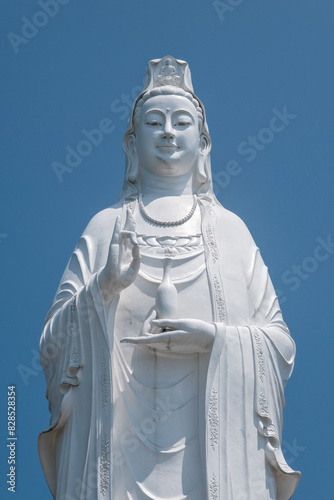 Lady Buddha statue in Chua Linh Ung Buddhist temple on sunny day. Da Nang, Vietnam.