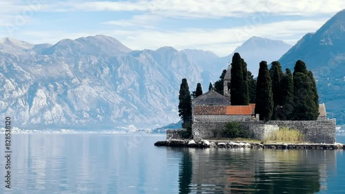 View of the St.George island and the seafront buildings in the Bay of Kotor in Perast, Montenegro photo