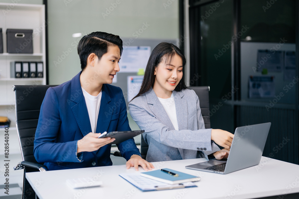 Kind leader executive manager share and discuss business solutions plan ideas on tablet with Asian female marketing manager Kind leader executive manager share and discuss business solutions plan ideas on tablet with Asian female marketing manager