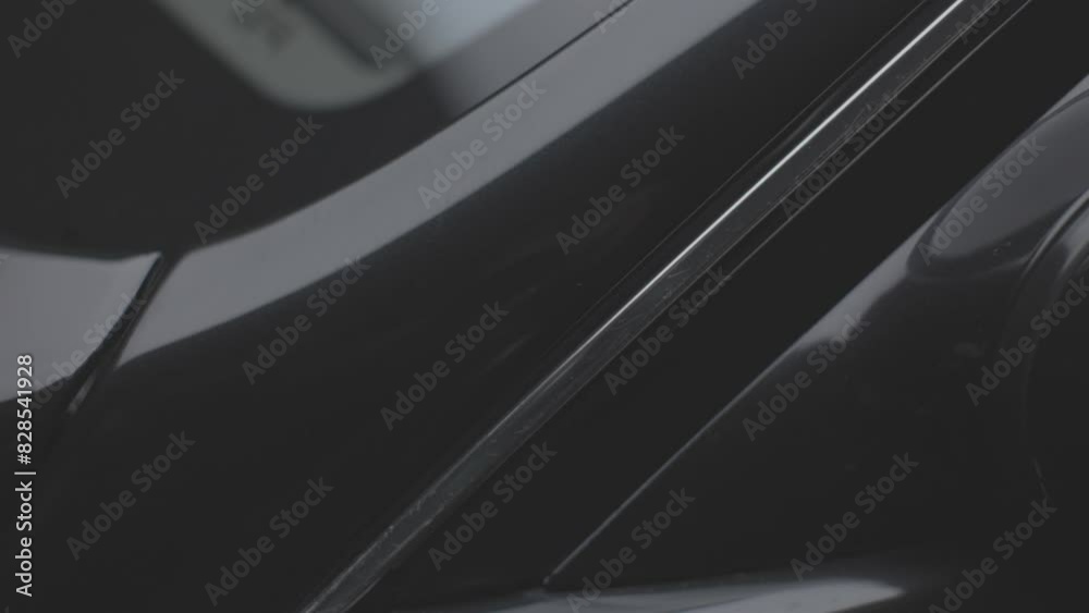 Super closeup shot on the details of a new black luxurious car Super closeup shot on the details of a new black luxurious car