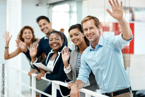 Happy, business people and hand waving to new employee for hello, support and recruitment on office balcony. Smile, corporate group and team with welcome greeting for onboarding and collaboration photo