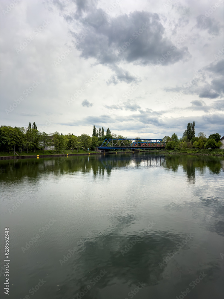 Train on water in park under cloudy sky Train on water in park under cloudy sky