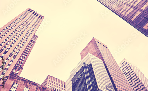 Looking up at New York skyscrapers, color toning applied, USA. © MaciejBledowski