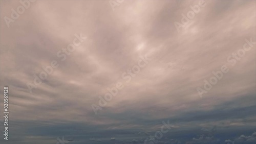 timelapse of the sky - beautiful goldish sundown with cloudiness - loop video photo
