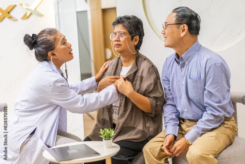 Obraz premium Woman doctor with stethoscope help support discussing and consulting care talk to sick senior asian woman patient in hospital,caregiver,elderly,recovery,illness insurance.healthcare and medicine