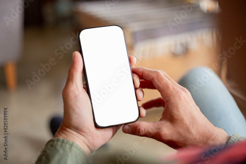 cell phone blank white screen mockup.hand holding texting using mobile on desk at office.background empty space for advertise.work people contact marketing business,technology