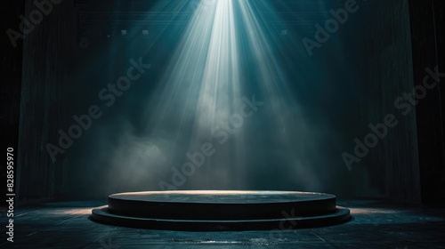 A spotlight shines on an empty stage waiting for a performance to begin photo
