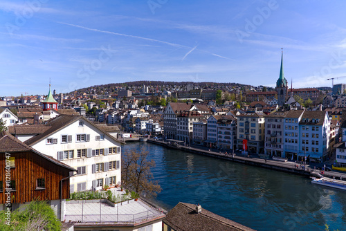 High angle view of Limmat River and cityscape seen from Lindenhof hill at Swiss City of Zürich on a sunny spring day. Photo taken April 5th, 2024, Zurich, Switzerland.