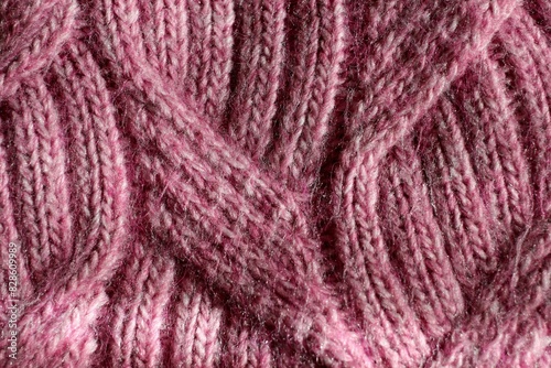 light pink pattern knitted from wool threads, background texture