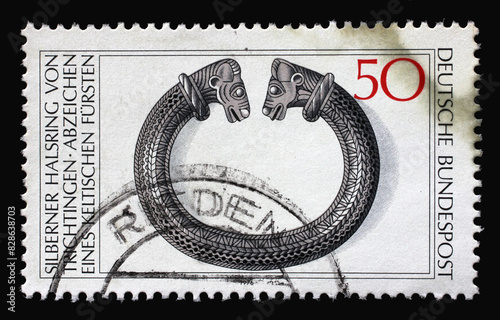 A stamp printed in Germany shows Archaeological Treasures: Silver Necklet from Trichtingen, circa 1976