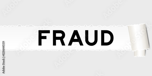 Ripped gray paper background that have word fraud under torn part