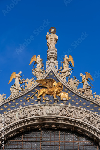 Winged Lion Of Saint Mark And Angels At Venice Basilica In Italy