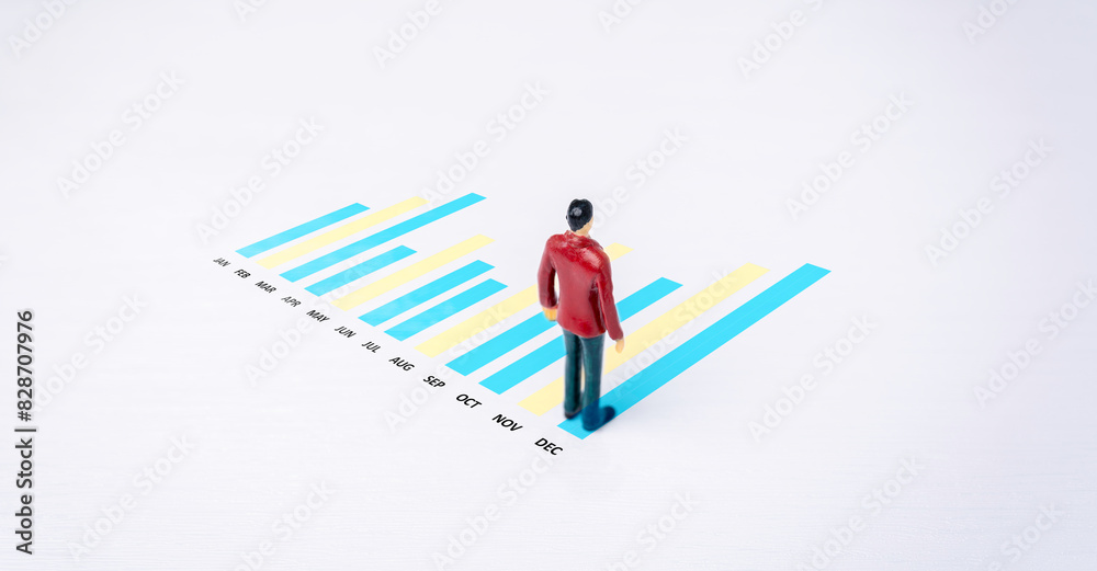 Business concept person analyzing data chart, visualizing monthly growth and performance trends for strategic planning.