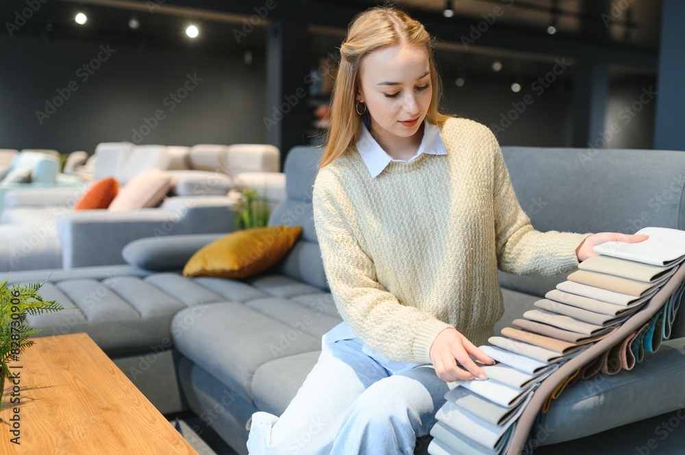 young woman shopping for furniture, sofa and home decor in store young woman shopping for furniture, sofa and home decor in store