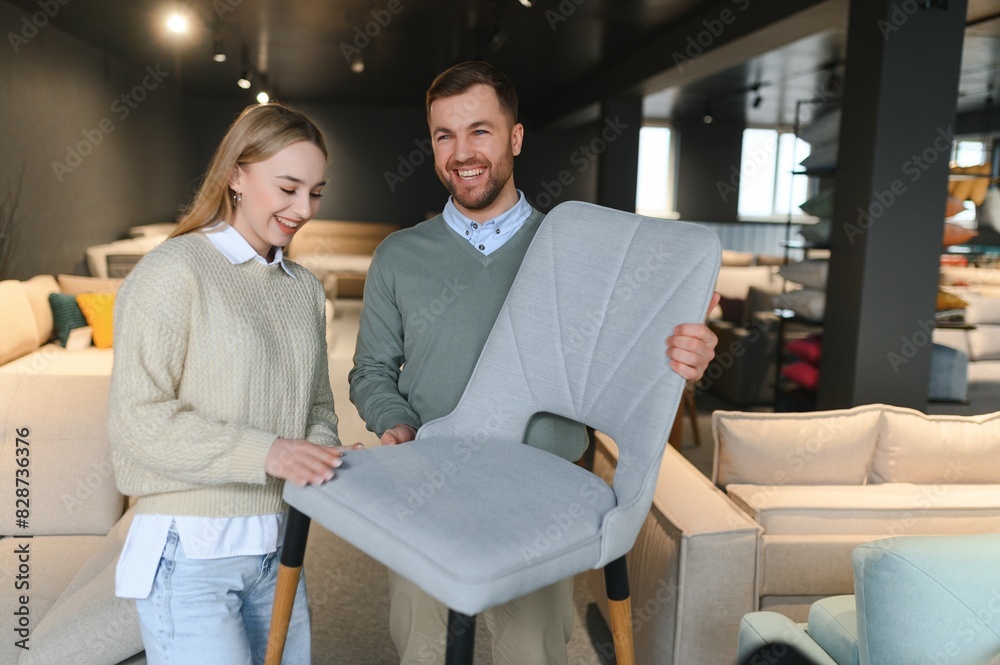 couple chooses chairs for the home in a store. couple chooses chairs for the home in a store.