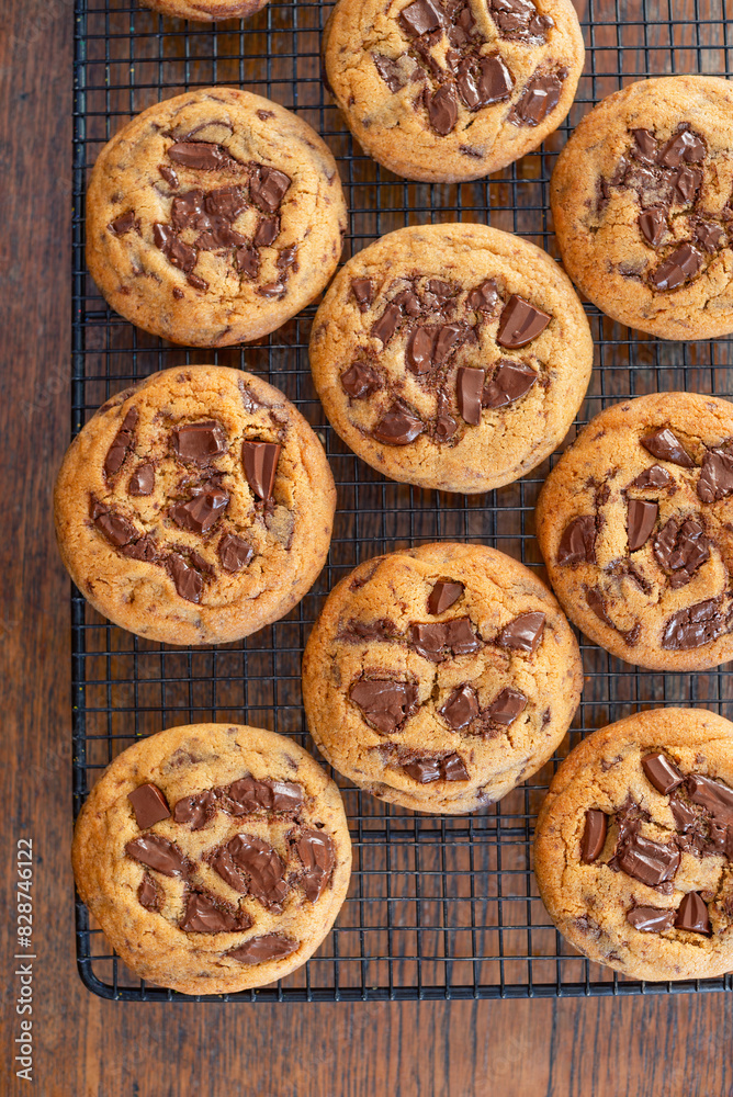 freshly bake homemade chocolate chip cookies on a cooling rack. freshly bake homemade chocolate chip cookies on a cooling rack.