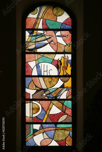 Easter breakfast, stained glass window in parish church Assumption of the Virgin Mary in Pregrada, Croatia photo