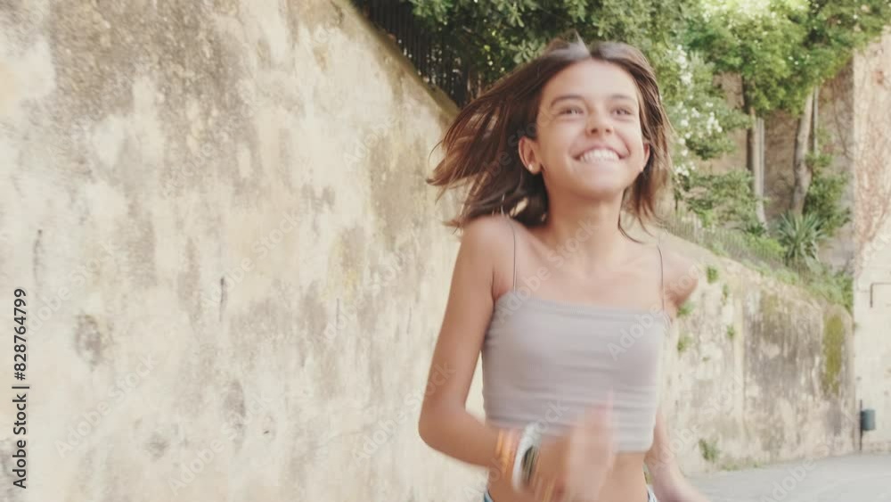 Portrait of a happy child running down the street and smiling Portrait of a happy child running down the street and smiling
