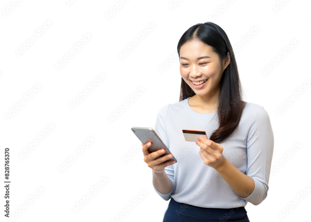 A smiling woman uses a smartphone while holding a credit card, making an online purchase A smiling woman uses a smartphone while holding a credit card, making an online purchase