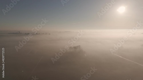 Above the Clouds: Aerial View of Friesland Farmland in Morning Mist (ID: 828772525)