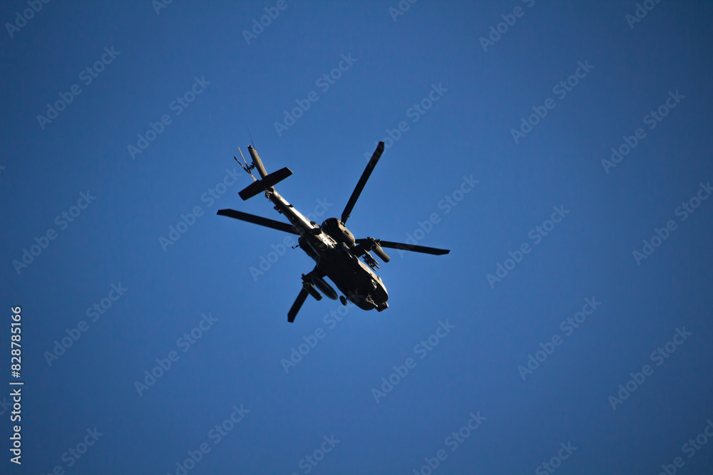 Military helicopter on a blue sky background Military helicopter on a blue sky background