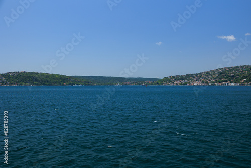 Turquoise blue sea water. View of the Bosphorus in Istanbul city on sunny summer day, in a public place. © Tatiana