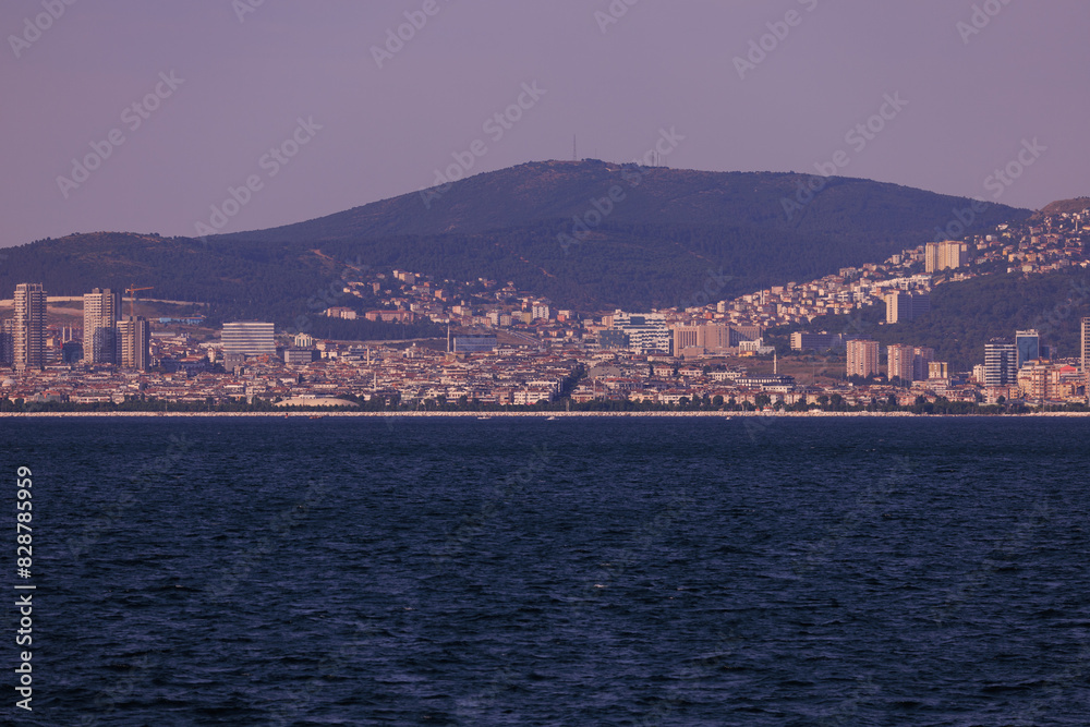 Fototapeta premium Turquoise blue sea water. View of the Bosphorus in Istanbul city on sunny summer day, in a public place.